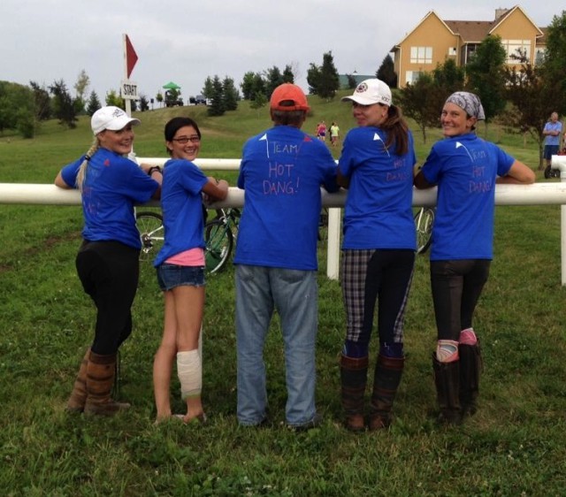 Team members showing off the backs of their Team Gear.