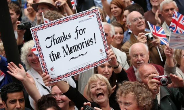 Hundreds of thousands of people line the streets of London during the athletes' parade following the 2012 Olympics. Photo by David Davies/AFP/Getty Images.