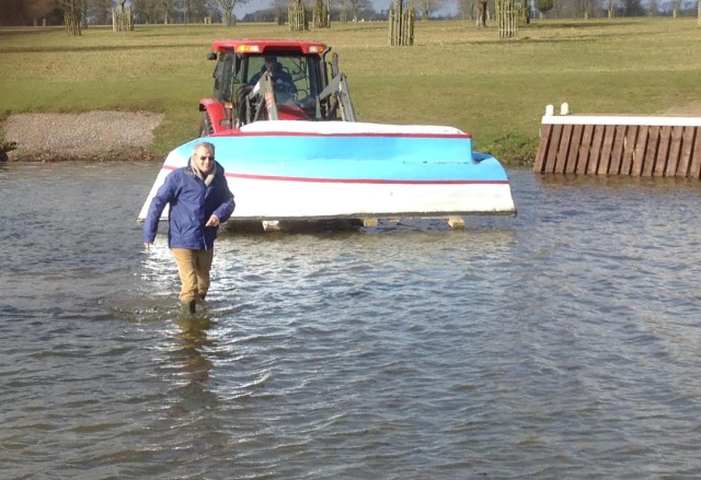 Badminton course designer Giuseppe della Chiesa leads the way to place a portable in the water. Photo courtesy of Tremaine Cooper.