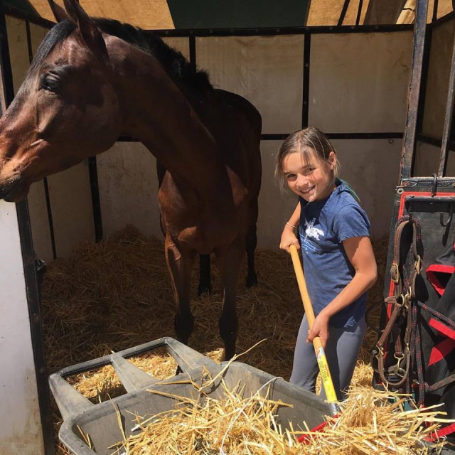 Gettin' it done! Taylor McFall is cleaning stalls at Twin Rivers to help raise money to fund her show season. Photo from Earl and Jen McFall's Facebook page