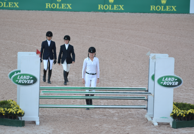 Jr. Novice riders walk their show jumping course. Photo by Leslie Wylie. 