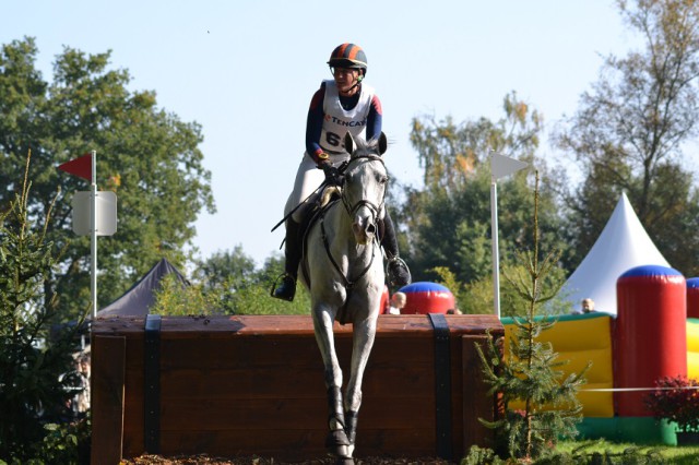 Lauren Kieffer and Landmark’s Monte Carlo on their way to a near double-clear finish at Boekelo 2015. Can we all just take a moment to appreciate the fact that there was a bounce house full of squealing kids just a few meters before this fence? Photo by Leslie Wylie.