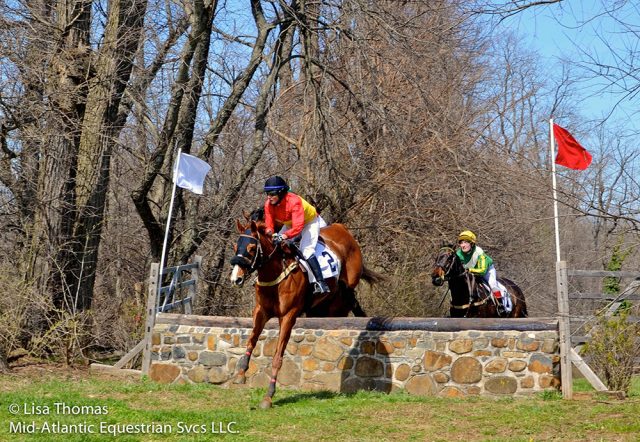 Jennie Brannigan and Joshua G. over the stone wall at Brandywine Hills. Photo by Lisa Thomas.