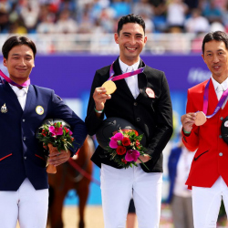 (L-R) Silver medalist Korntawat Samran of Thailand, gold medalist Alex Hua Tian of China and bronze medalist Kazuhiro Yoshizawa of Japan celebrate during the medal ceremony for the Eventing individual competition during the 19th Asian Games on 2 October 2023, in Hangzhou (CHN) © FEI/Yong Teck Lim 